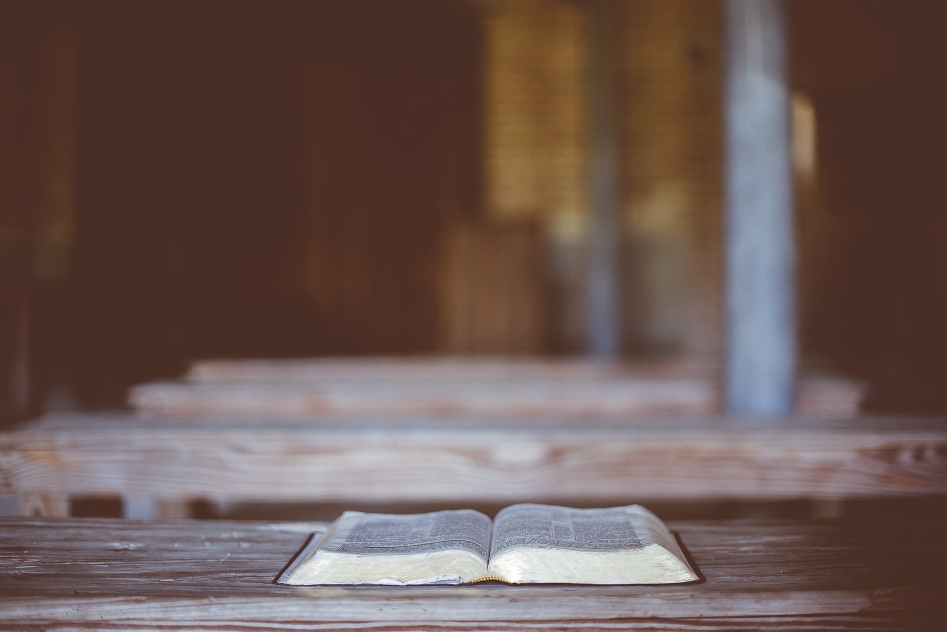 Bible open on an old table